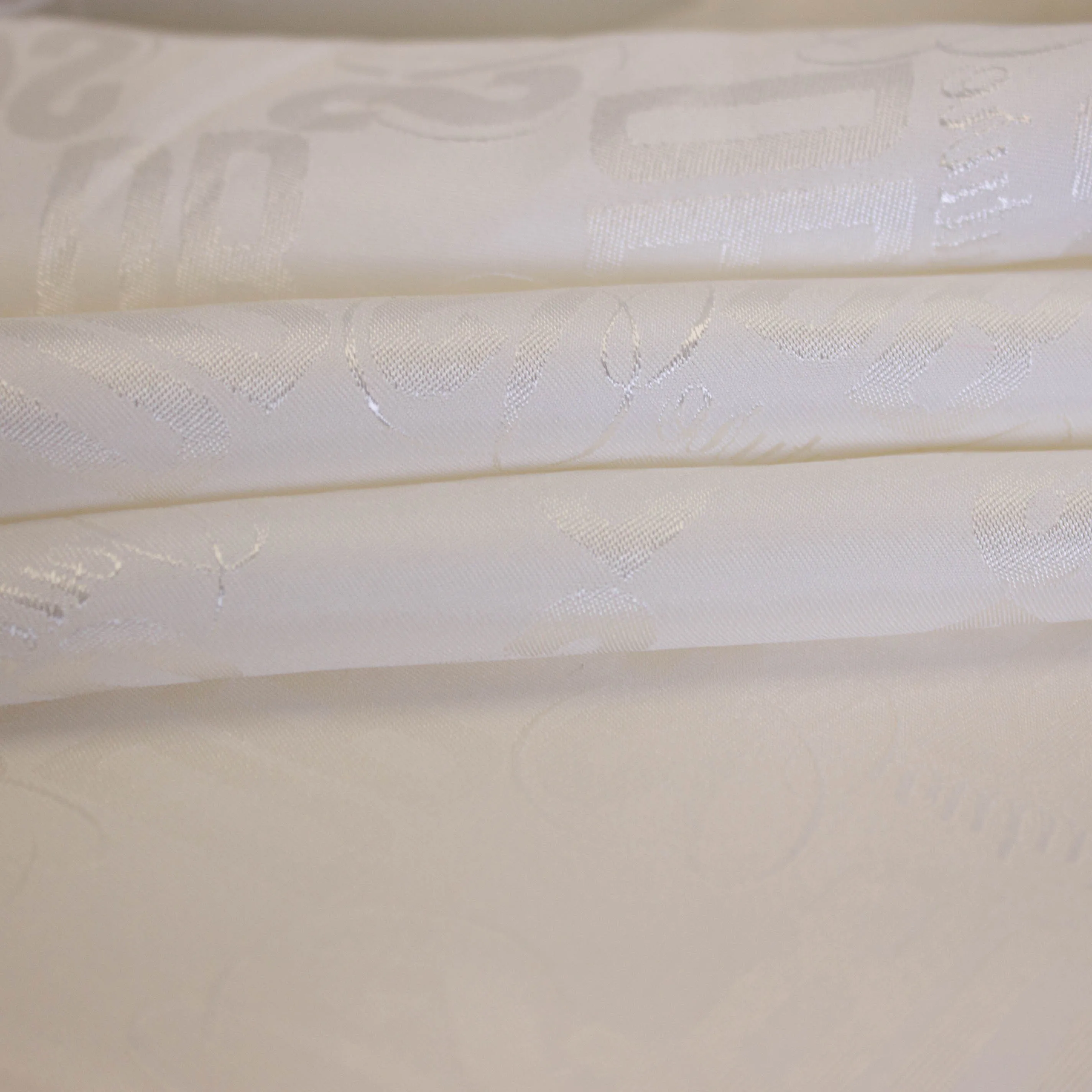 Fantasievoering ecru met DB couture logo